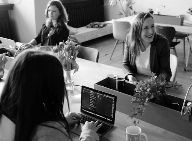 Women at table on computers